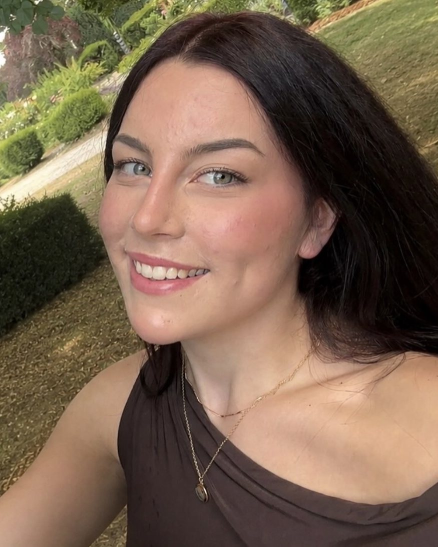 Tegan, the owner of That's Waxed, smiling outdoors